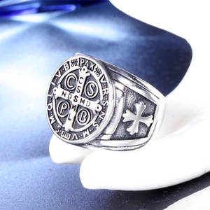 Detailed macro view of St. Benedict vintage steel ring with intricate cross carvings
