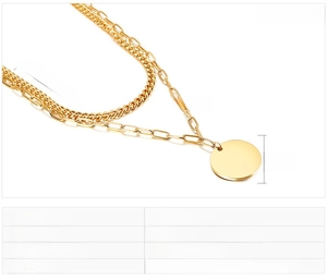 Macro detail of gold-plated double-layer woven chain necklace with round tag pendant
