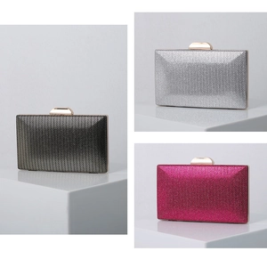 Detailed view of PU evening clutch bags in black, silver, and rose with chevron texture