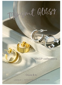 Detaillierte Nahaufnahme von 14KGP C-Ohrringen mit Zahnradstruktur in Gold und Silber