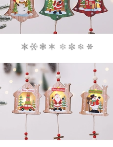 Detail of wooden LED Christmas ornaments with Merry Christmas text and warm bokeh light