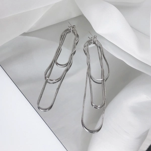 Elegant silver triple-layered snake chain tassel earrings for a minimalist look