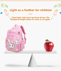 Lightweight pink bunny schoolbag for kids shown on a scale weighing less than an apple