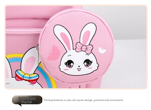 Detail of pink school backpack featuring a cute rabbit print and a small round coin purse