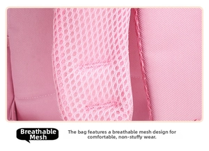 Detail of pink schoolbag shoulder strap featuring breathable honeycomb mesh padding