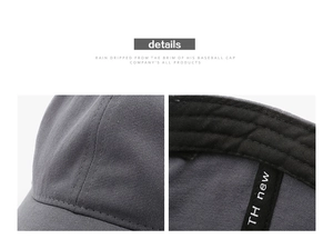 Détails du tissu en toile gris foncé et de la bande de propreté interne d'une casquette