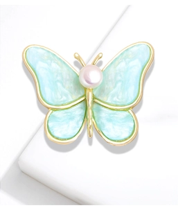 Elegant gold butterfly brooch with blue marble wings and central white pearl accent