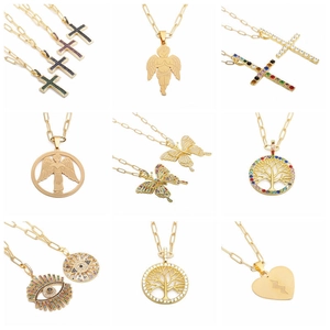 Golden stainless steel necklace set featuring cross angel and heart pendants with color gems
