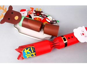 Detail of Santa and reindeer cartoon Christmas cracker gift boxes with festive candy treats