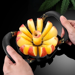 Zinc alloy apple slicer with gold floral handles cutting fruit into 8 equal wedges