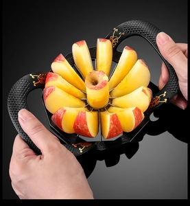 Zinc alloy apple slicer with plastic handles cutting a fresh fruit into 8 pieces