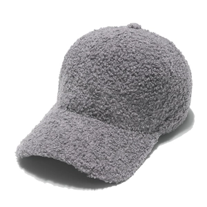 Close-up of grey sherpa baseball cap showing warm fleece texture and curved brim