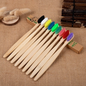Eco-friendly bamboo toothbrush set with multi-colored bristles in a natural panda box