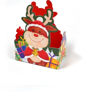 Detail of Christmas gift box with cartoon reindeer pattern and red festive printing