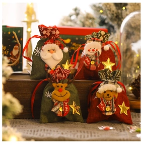 Detail of Christmas drawstring gift bags featuring 3D Santa, Snowman and Reindeer dolls