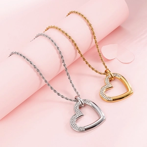 Pendentif coeur élégant en acier inoxydable avec cristaux étincelants en or et argent
