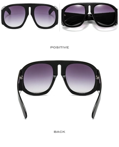 Detail view of oversized black square sunglasses with purple gradient lenses from all angles