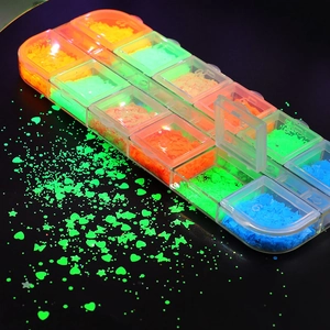Luminous nail art glitters in a 12-grid storage box with heart, star, and butterfly shapes