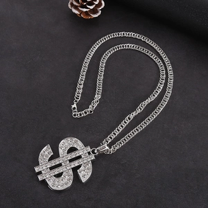 Detail of silver hip hop necklace featuring a crystal-encrusted dollar sign pendant