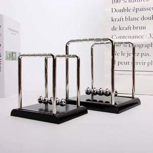 Comparison of large and medium Newton's cradle balance balls on a sleek black base