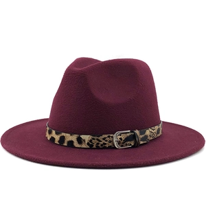 Detail of burgundy wool fedora hat featuring leopard print belt with silver buckle