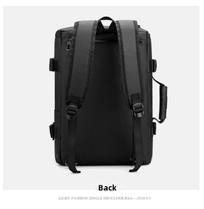 Detail view of the padded shoulder straps and reinforced side handle of a black business backpack
