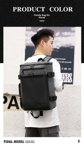 Grey waterproof business travel backpack shown in outdoor use on a male model