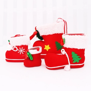 Set of red flocked Christmas boot candy bags with plush trim and festive patterns