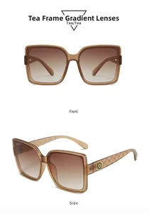 Detail of square tea-tinted sunglasses with quilted texture temples and golden floral logo