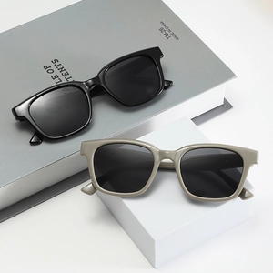 Classic square frame sunglasses in black and taupe with wide temples and dark lenses