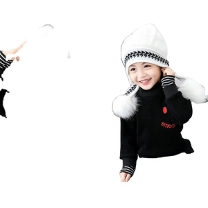 Winter set for kids featuring a white knit beanie with pom-pom and a black turtleneck sweater