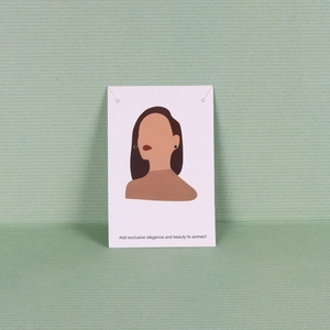 Elegant small dark stud earrings displayed on a professional white illustrated jewelry card