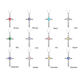 Cross necklace set with heart-shaped birthstones for 12 months in a silver finish