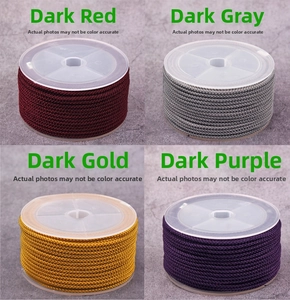 Macro detail of 2mm pineapple cord spools in dark red, gold, purple and gray