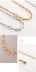 Detail of adjustable lobster clasp and polished chain links on minimalist steel necklace