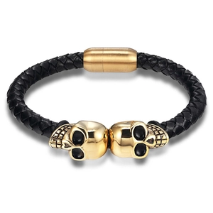 Braided black leather bracelet with golden skull accents and magnetic clasp for men