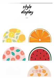 Detail view of assorted fruit and rainbow semi-circle non-slip bathroom floor mats