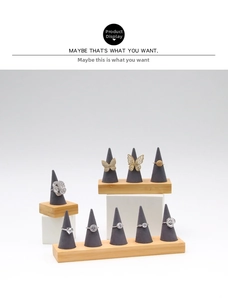 Macro view of multi-style fashion rings on high-end cone jewelry display stands