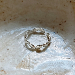 Macro view of olive leaf pattern 925 sterling silver adjustable open ring