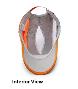 Detail view of quick-dry kids baseball cap interior with breathable orange mesh and strap