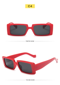 Detail view of red rectangular sunglasses with dark lenses from front and side angles