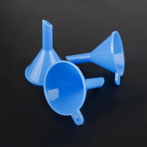 Three blue plastic mini funnels with handles for liquid transfer on black background