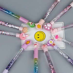 Colorful creative liquid glitter pens with cute cartoon caps in a starburst arrangement