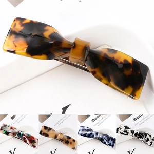 Detail showing various acetate hair claws in tortoise shell and marble patterns