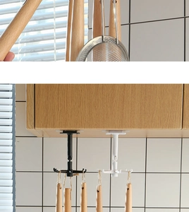 Kitchen rack featuring 360-degree rotating hooks for utensils in black and white finish
