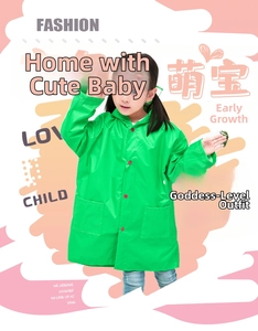 Detail of green hooded kids raincoat with red buttons and large square pockets
