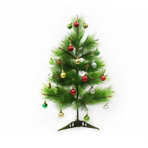 Mini green Christmas tree with multicolored baubles on a decorative cutout tripod stand