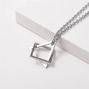 Minimalist silver geometric interlocking square and triangle pendant necklace on cube