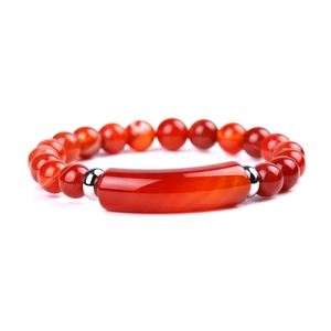 Detail of red agate bead bracelet with a central rectangular stone and silver spacers