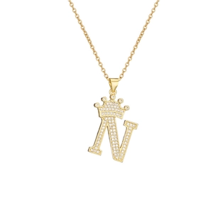 Macro detail of gold-plated crown letter N pendant with micro-pave cubic zirconia crystals